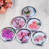 Espejo de Maquillaje Portátil para Souvenir de Viaje al por Mayor del Fabricante, Espejo Plegable Creativo Personalizado de Doble Cara, Espejo Pequeño Redondo, Portátil