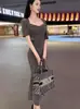 Conjunto de Dos Piezas de Falda Larga con Tirantes Plisada de Cuello de Pila Ajustada de Nuevo Estilo Primavera-Verano de Dongdaemun, Corea del Sur + Cárdigan de Manga Corta