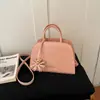 Nuevo bolso de mano con patrón de diamantes para mujer, otoño temprano 2026, bolso de hombro y cruzado versátil vintage, bolso pequeño para el trabajo, bolsos de mujer al por mayor