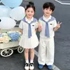 Atuendos de Verano para Niños y Niñas 2026 Nuevo Estilo Casual Universitario Chal Rayado Falda de Manga Corta y Pantalones para Niños y Niñas