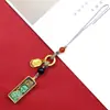 Aço Titânio Mini Thangka Pingente de Celular Deus da Riqueza Amarelo Zakiram Pequeno Thangka Pendente de Bolsa Joia de Moda Pingente