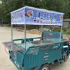 Puesto completamente cerrado de acero inoxidable con encimera, vehículo de tres ruedas, puesto de barbacoa Roujiamo para mercado nocturno, puesto de vehículo de snacks Liangpi para brochetas fritas
