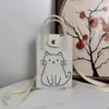 Nueva bolsa de teléfono tejida con diseño de gato de dibujos animados, bolso de mano y bolso cruzado, diseño de nicho, versátil para ir al trabajo, bolso de hombro