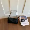 Bolsa de Mão de Nicho Estilo Francês para Mulheres, Nova Moda Verão 2026 Bolsa Transversal, Versão Coreana com Acabamento de Alto Padrão, Bolsa Baguete de Ombro Único
