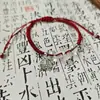 Nuevo Cordón de Mano con Hebilla Ping An Jinse Nianhua Chino Marca Fu Pulsera Tejida Roja Pulsera Antigua de Estilo Étnico para Mujer Venta al por Mayor