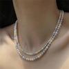 Nuevo collar de perlas de imitación de color Shijia para mujer, de alta gama, estilo nicho, exquisito, combinable, elegante, cadena de clavícula apilada.