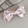 Pinza para el cabello de satén con lunares y lazo estilo coreano, de alta gama, pasador exquisito y elegante, diseño de pinza retorcida, accesorio para el cabello de nicho