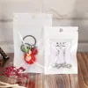 Bolsa de plástico translúcida con forma de hueso Yin y Yang, con película de perla blanca, para empaquetar carcasas de teléfonos móviles, mascarillas, cables de datos y autosellado.