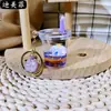 Muñeco de Perro con Corona Morada Flotando en Aceite, Pequeña Figura de Perro Blanco, Llavero de Botella con Arena Líquida, Colgante de Regalo de Dibujos Animados Lindo