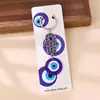Nuevo llavero transfronterizo con colgante de elefante, palmera y pavo con ojos azules, para bolso o coche.