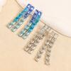 Aretes de lujo ligero estilo europeo y americano Joker simple borla larga gota para la oreja moda cara cuadrada adelgazante aretes al por mayor para mujer