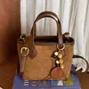 Otoño 2026 Nuevo Bolso Cubo de Mano Simple y de Moda Estilo Retro Chic para Viajar Estilo Coreano Bolso de Hombro Único Cruzado