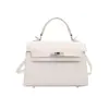 Outono 2026 Nova Bolsa Kelly Bolsa de Mão Fresca de Alto Padrão Bolsa Transversal Feminina Bolsa de Design Nicho com Sensação de Alto Padrão bolsas