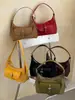 Nuevo bolso de hombro de color liso de alta moda para principios de otoño de 2026, bolso de hombro de nicho moderno y elegante para el trabajo y los desplazamientos, bolso cruzado