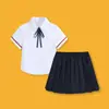 Conjunto estilo escuela de verano para niños y niñas, camisa de manga corta de algodón puro, shorts resistentes a las arrugas, conjunto de dos piezas con falda, versátil para niños