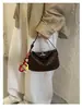 Bolso tejido tipo empanada súper popular transfronterizo para mujer, nuevo diseño de nicho 2026, bolso cruzado versátil de alta gama para el día a día
