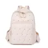 Comercio exterior al por mayor 2025 nuevo bolso de hombro casual para mujer de nailon moda remache almacenamiento exterior mochila de viaje tendencia