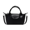 Bolso de Nylon para Mujer con Diseño de Nicho Tendencia Coreana Otoño Retro Pequeño Cuadrado de Mano Versátil Hombro Cruzado Bolso Dumpling