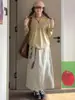 Saia Casual Cinza-Branca para Trabalho Feminino, Novo Estilo Primavera 2026, Saia Evasê Solta de Cintura Alta, Meia Saia Elegante de Caimento Solto