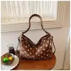 Bolso de mano de moda retro de lunares para mujer, nuevo bolso versátil de gran capacidad para el otoño e invierno de 2026, para ir al trabajo, de hombro y cruzado