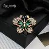 Moda europeia e americana novo broche de borboleta com diamantes de alta qualidade temperamento feminino alfinete requintado corsage da moda joia de cristal