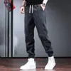 Pantalones de chándal de pana para hombre, estilo primavera y otoño, holgados y versátiles, pantalones casuales de retazos, pantalones jogger para hombre