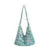 Bolsa de lona de gran capacidad para mujer, nuevo modelo 2026, estilo commuter de alta gama, estampado floral dulce, bolso tote de un solo hombro para llevar debajo del brazo