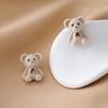 Lindos pendientes de oso con lazo flocado, pendientes de niña de dibujos animados japoneses y coreanos, otoño e invierno, todo a juego, joyas de orejas de peluche de celebridades de Internet