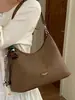 Bolsa de brim de grande capacidade para mulheres, nova bolsa versátil de ombro e transversal para o verão de 2026, bolsa tote para ombro de trajeto transfronteiriço
