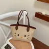 Bolsa Pequena de Gato Tecida da Moda 2026 Estilo Novo de Primavera Versátil para o Dia a Dia Bolsa Tecida Estilo Férias na Praia Bolsa de Ombro