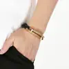 Pulsera de cordón de cuero negro de doble capa estilo business exclusiva transfronteriza con brazalete de alambre tejido de acero inoxidable para hombre