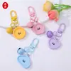 Llavero Colgante de Flor Geométrica de Resina con Cara Sonriente de Color Caramelo Forma de Corazón DIY Accesorio Creativo para Mochila Decoración