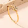 Anillo Transfronterizo Nuevo de Acero Inoxidable para Mujer Estilo Frío Dorado Simple Lujo Ligero Diamante Micro 1.5mm Anillo de Acero de Titanio Fábrica
