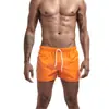 Nuevos pantalones de fitness de verano transfronterizos europeos y americanos para hombre, cómodos, transpirables, de color sólido, para correr, deportes de ocio y entrenamiento.
