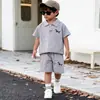 Traje polo de manga corta para niños algodón nuevo logo de cachorro traje para niños niños top de color liso venta al por mayor de fábrica