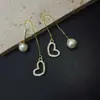 Estilo Coreano Pequeños y Exquisitos Pendientes de Hilo de Amor Perla Tapón de Oreja Simples Elegantes Pendientes Largos Estilo Nuevo Personalidad Pendientes Elegantes