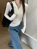 Suéter tejido de manga larga clásico estilo francés para mujer, nueva colección otoño/invierno 2026, corte ajustado, que estiliza la figura, con un sofisticado diseño de cuello en V y versátil para varios atuendos