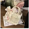 Bolso Cuadrado Hueco con Lazo de Mano Cruzado Retro Casual Tejido de Paja Bolsa de Playa para Mujer Venta al por Mayor