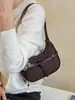 Elegante bolso de axila estilo francés para mujer, nuevo modelo 2025, bolso de media luna de diseño nicho, bolso versátil de un solo color para hombro y cruzado