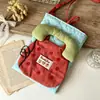Nueva bolsa de almacenamiento estudiantil versátil a cuadros con temática de muñecas, bolsa de tela linda estilo coreano con relleno de algodón, bolso cruzado para mujer para llevar al hombro para teléfonos