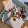 Llavero de Etiqueta Estampado de Leopardo Retro Maillard Cuerda Trenzada Marrón Colgante de Oso Llavero Personalizado para Bolso