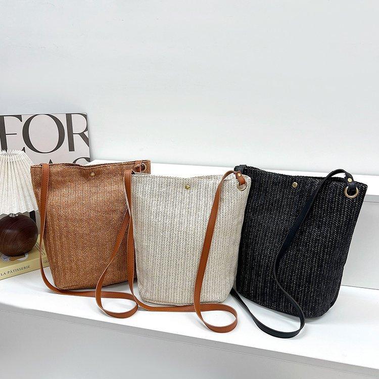 编织包女包新款潮2024夏草编简约百搭小清新水桶包个性单肩斜