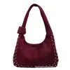 Bolso de mano de gamuza de estilo nuevo para invierno 2026 transfronterizo para mujer, bolso de hombro esmerilado con remaches, bolso tote moderno para el trabajo