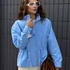Moda transfronteriza europea y americana, chaqueta casual de color liso estilo Harajuku con cuello alto para mujer, con cintura de cordón y diseño de bolsillo, al por mayor