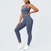 Conjunto de outfit de yoga ajustado con diseño deportivo en la espalda, de tela cepillada con bloques de color transfronterizos, sensación nude, pantalones largos de cintura alta para levantar glúteos para correr y fitness