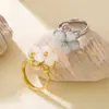 Anillo Elegante para Mujer Estilo Chanel Flor de Cinco Hojas, Nuevo Modelo Transfronterizo con Piedra Ojo de Gato Giratoria, Joyería de Diseño Exquisito