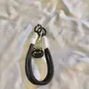 Cuerda para Puerta Blanca y Negra Colgante de Pez Pequeño Gato Pulsera Tejida Funda Universal para Teléfono Móvil Joyería Correa para Teléfono Móvil Cámara CCD