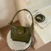La popular bolsa de dumplings tejida de este año para mujer 2026 nueva elegante simple bolso de hombro coreano nicho bolso cruzado