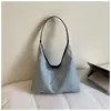 Bolsa tote grande capacidade estilo preguiçoso 2026 nova bolsa feminina versão coreana bolsa de ombro simples para trabalho e trajeto bolsa de axila