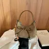 Bolso retro de ante tipo dumpling, estilo coreano, nueva colección otoño 2026, bolso tote simple y elegante con un lazo, adecuado para el uso diario